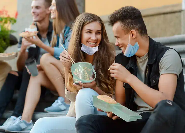 FSG Brand-Spotlight-Blog- Eco-Takeouts-post-1-FSG students with eco-takeout containers